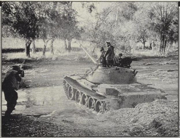 This photo be Sean Jones shows Rafiullah Khan for the last time filming the same tank moments ago that rolled over him. The funeral prayers of Rafiullah Khan was led by Molvi Jalaludin Haqqani himself and he was buried there.