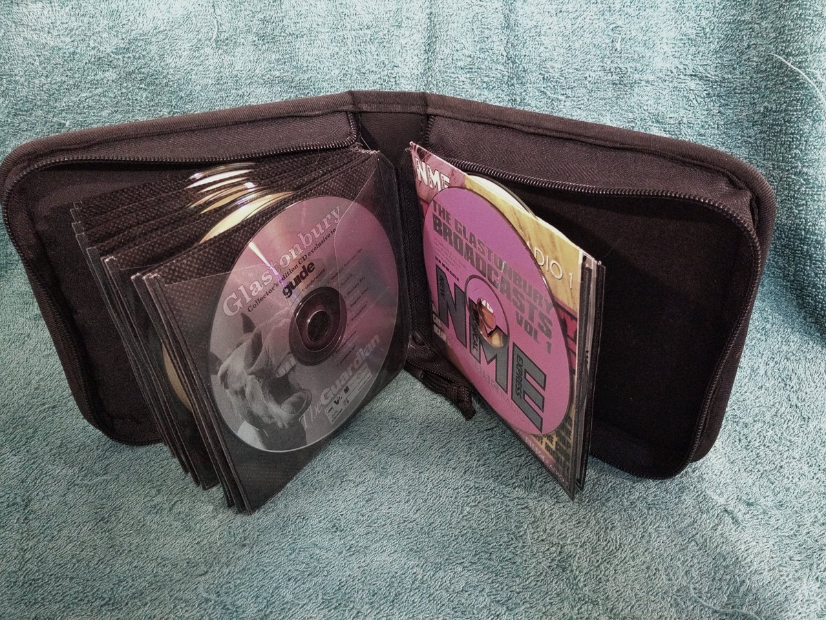 One of our volunteers sent us a picture of his CD case: “You had to take a case of CDs on holiday with your CD player. This is one of mine. The image of the case open shows some giveaway CDs from Glastonbury”. What’s in your CD case?