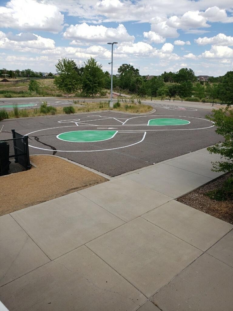COBarricade's tweet photo. Our CB Striping Division created a bike course in the rec center parking lot in Montbello using MMA, a material we've never used before. Check out some of these awesome pictures! #striping #pavementmarking #bikecourse https://t.co/P9Y4vgKQsm