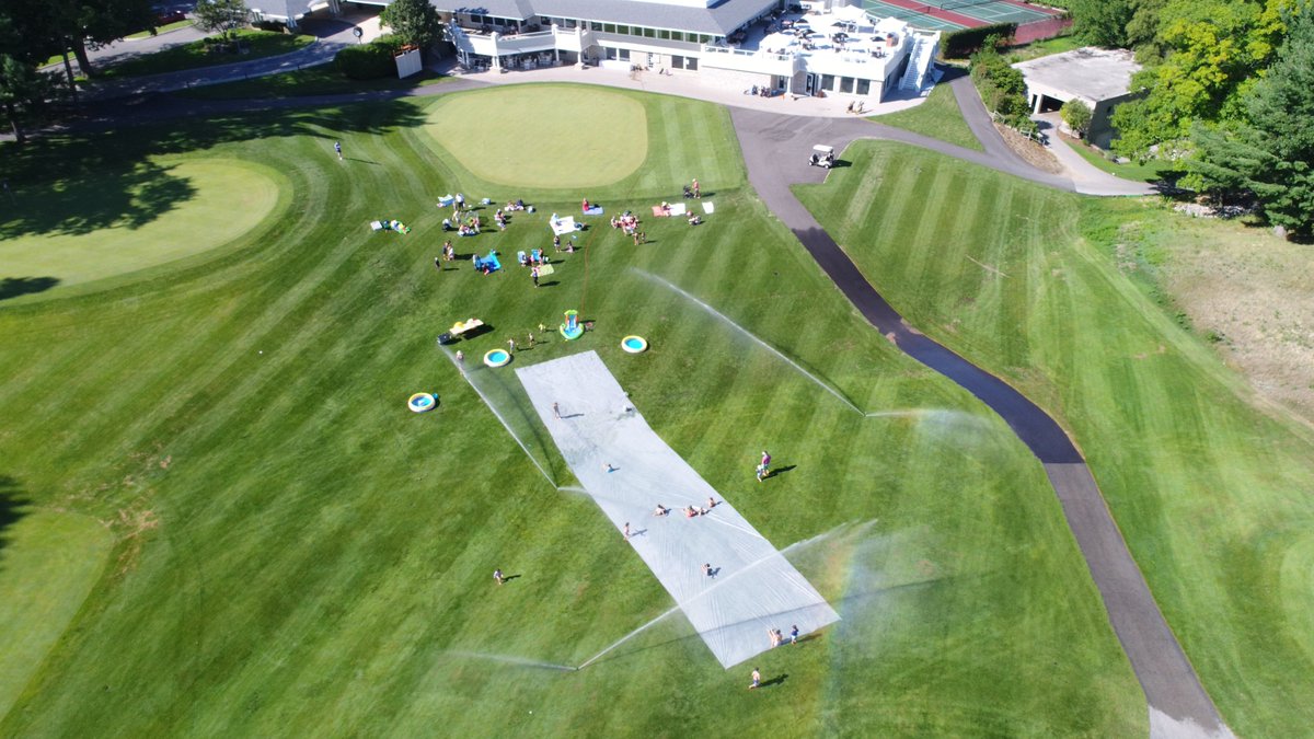 Slip-n-Slide-n-Pizza Night.  82 people by 6:15.  Hand spray bottles of a baby shampoo mixture worked amazing!