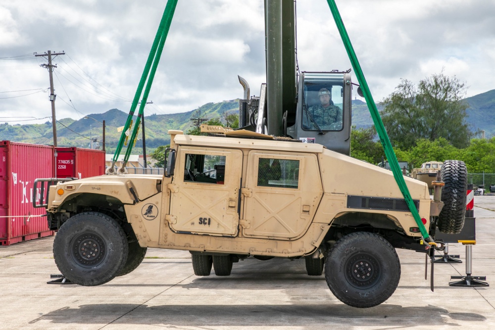 USPACOM's tweet photo. Seabees assigned to Naval Mobile Construction Battalion #NMCB1 in Guam perform turnover lifts with a Humvee as part of the battalion evaluation equipment program #BEEP demonstrating the crane is in proper working order. #ForgedByTheSeabees #FreeandOpenIndoPacific. https://t.co/O35ha0oisc