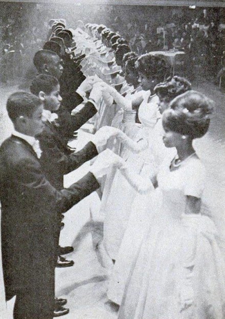 Brown Skin Girl portrays a debutante ball, which have been commonplace celebrations of young women among African Americans since the early 20th century. The girls debuted here were also honored for their academic and career succes.