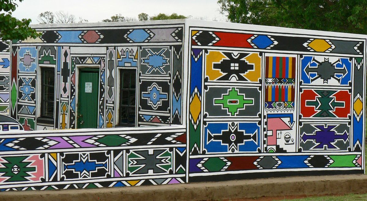 The visual draws heavy inspiration from the art of the Ndebele of South African, which was largely popularized by artists such as Esther Mahlangu.