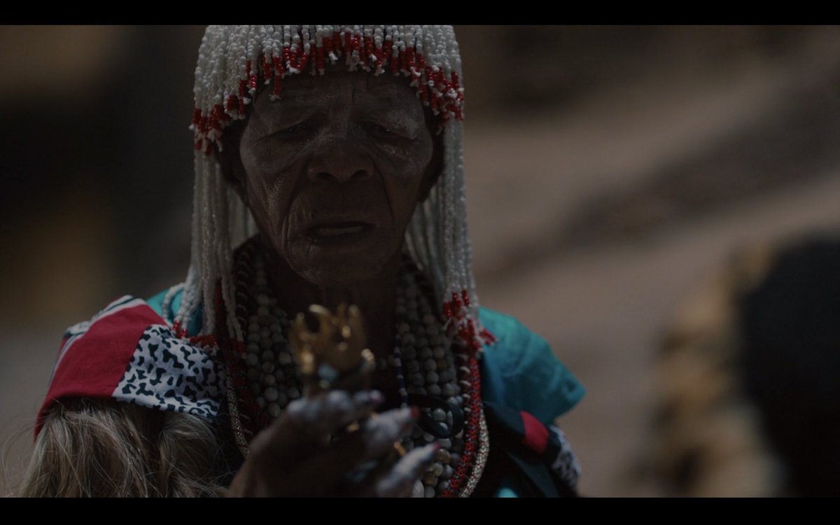 The legendary South African actress Mary Kuksie Twala-Mhlongo, portrays an elder whom Simba presents his fetish (nkisi as called by the BaKongo of Zaire) to prove he is ready for his inheritance. Mary passed away on July 4th, and leaves behind a legacy of respect 