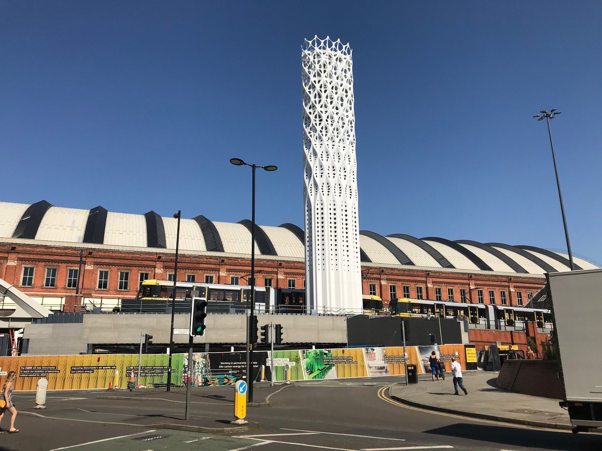 Manchester Centrals 150 year old train station Central Hall makes for the backdrop of the new tower of light for the new Civic Quarter combined heat and power network in Manchester #oldmeetsnew