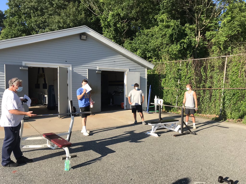 AHSFtball's tweet photo. Small group workouts have begun!  Boosters and coaches working hard to keep our players safe.  We installed an outdoor hand washing station, moved equipment outdoors, clean between each set, and perform temp checks.  Masks, sanitizer and lots of distancing!
Together again. 💙💛🏈 https://t.co/ECmllF6smm