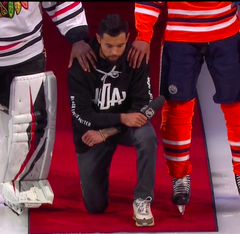 ThomasDrance's tweet photo. Matt Dumba: "Black lives matter, Breonna Taylor's life matters."

He becomes the first NHL player to take a knee as the anthems play with Malcolm Subban and Darnell Nurse supporting him. 

Incredible leadership from the #MNWild defender: https://t.co/3tLMXImQ8r