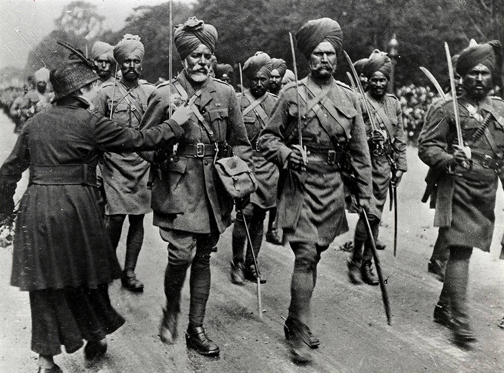 The Sikhs in British Indian Army fought the World War I & II with valour. The Saviours of France, a lady puts a flower on chest of a Sikh soldier.