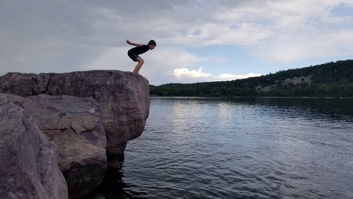 Jbmb155's tweet photo. Jumping off the rock at Devils Lake State Park. The rainbow that popped out was pretty awesome too!  One of our favorite summertime moments!!!
@LumosLearning 
#LumosLearning
#SummerLearning https://t.co/q5QboCjO1j