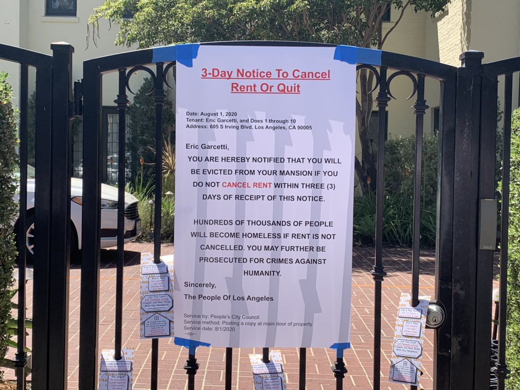 On the day rent’s due, protesters deliver eviction notice to Mayor Garcetti at the Getty House: ”You are hereby notified that you will be evicted from your mansion if you do not cancel rent within 3 days of receipt of this notice.”
