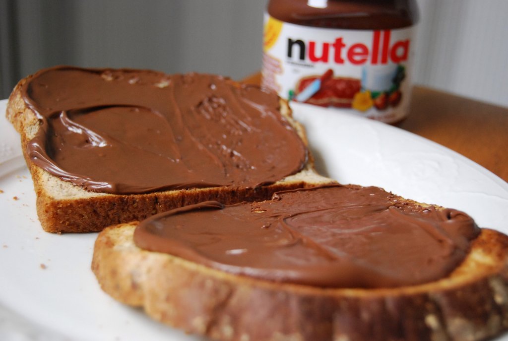 chocolate spread on toastthese pictures show nutella but i dont even like nutella i like just pure chocolate spread ITS AMAZING