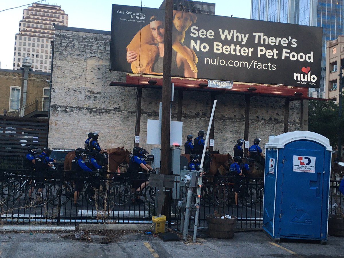 Cops on bikes and horses primed just around the block on 3rd