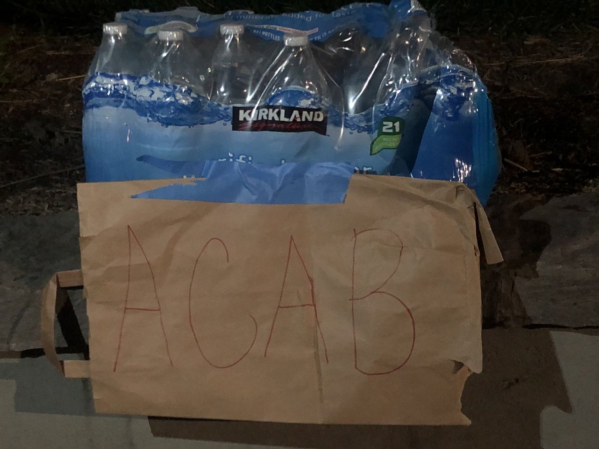 As some press walk back to our cars, we find someone has put out water bottles for protesters to grab in front of their house.  #Portland  #protest  #BlackLivesMatter    #acab