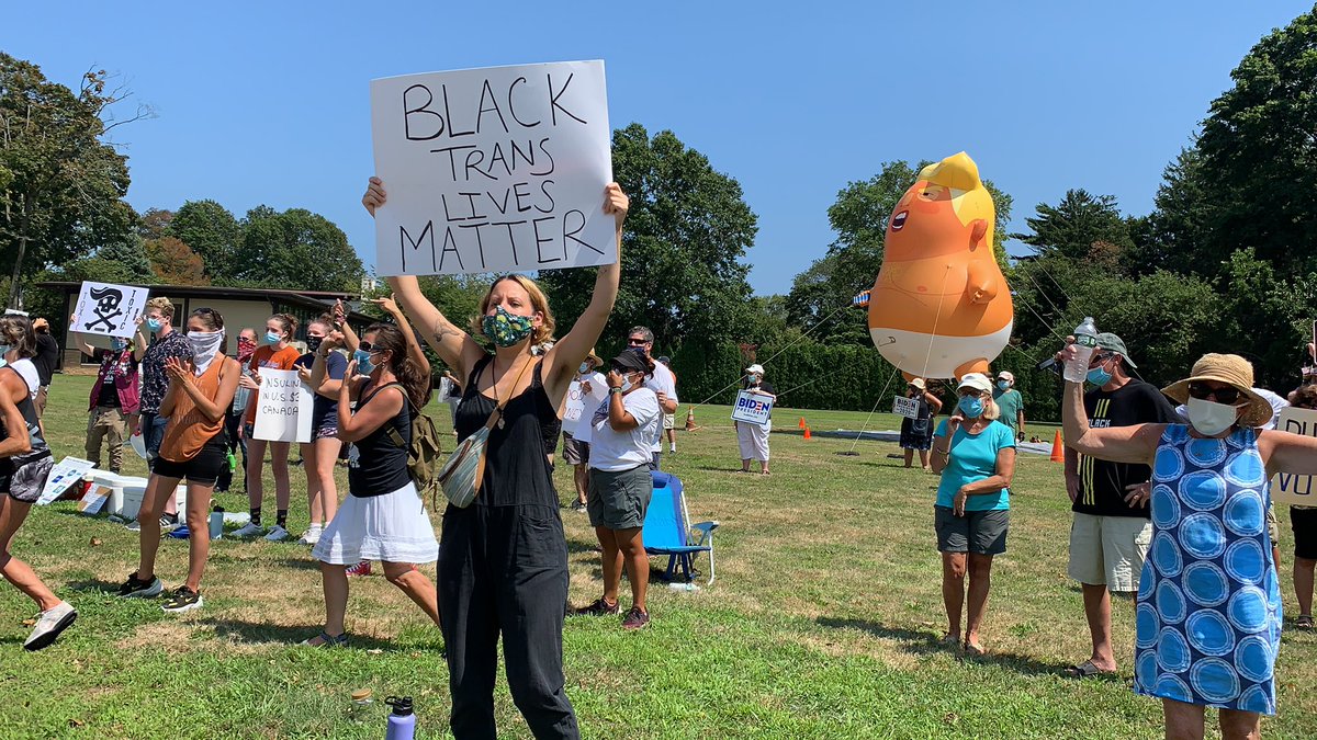 byMikeDavis's tweet photo. I’m at the #Elberon train station, where Baby Trump and 50ish people are protesting against the president’s fundraiser today. One just yelled “GO BACK TO NEW YORK” at a 17-18 yo kid in a car with NY plates who was giving the Kid Rock middle finger. https://t.co/Eza2ZefjBE