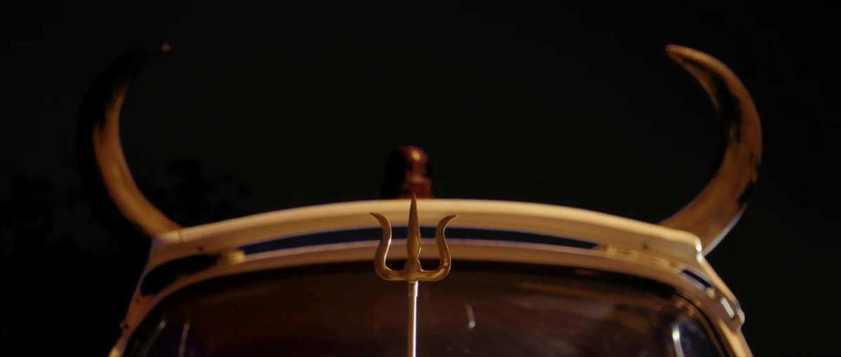 We wanted a stretch limo for this guy but a regular white Ambassador turned up on shoot. It had a working horn, but we added a couple more... (could we still do this?)