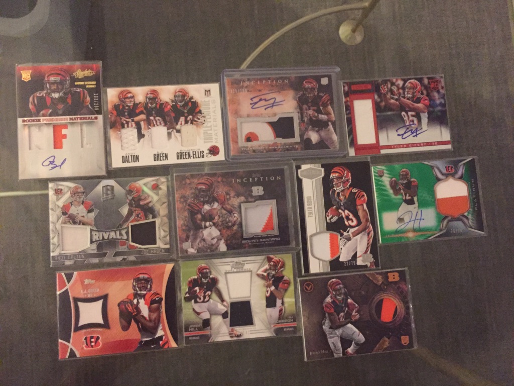 Bengals:Giovani Bernard RPA /299: $10Andy Dalton/AJ Green/BenJarvus Green-Ellis triple relic: $8Tyler Eifert RPA /99: $8Tyler Eifert RPA /150: $7Dual relic with Andy Dalton /99: $7Giovani Bernard patch /93: $6Tyler Boyd patch /75: $6Jeremy Hill RPA /99: $6(continued)