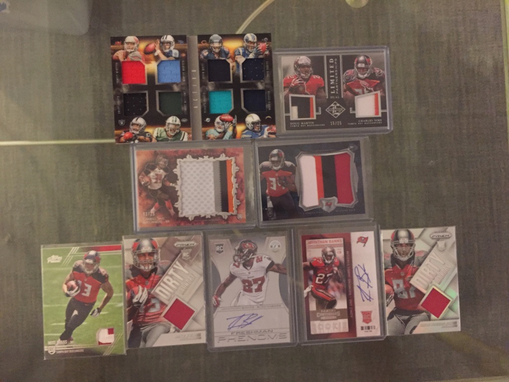 Buccaneers:8x relic booklet /199 with Jameis Winston: $20Doug Martin/Charles Sims dual patch /25: $12Charles Sims patches (Inception /25): $7 eachMike Evans patch: $6Mike Evans relic: $5Jonathan Banks autos (TC /499): $4 eachAustin Sefarian-Jenkins relic: $3