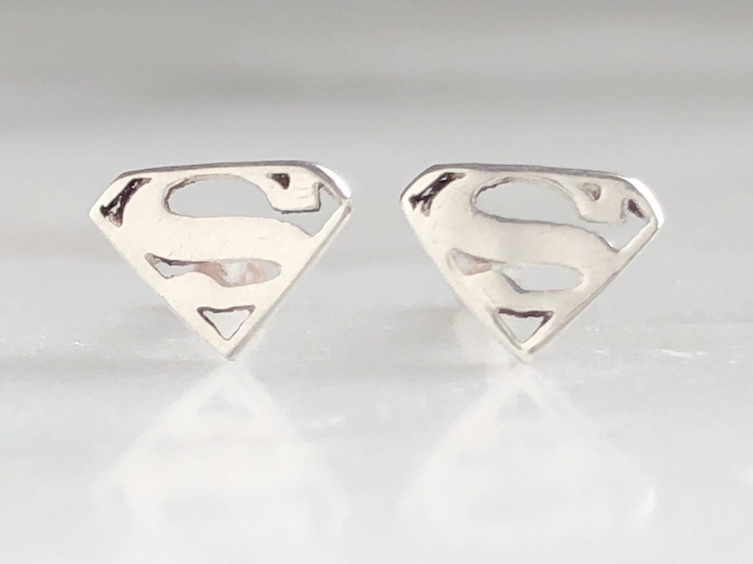 Supergirl stud earrings sale