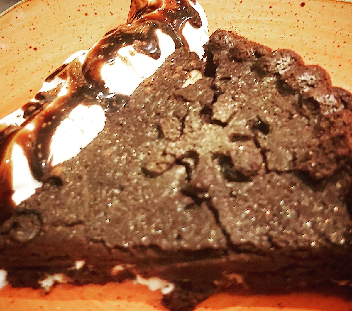 Chocolate fudge brownie cookie,with white chocolate chunks, lashings of cream,chocolate sauce and sparkle. 
Totally #glutenfree and #vegan