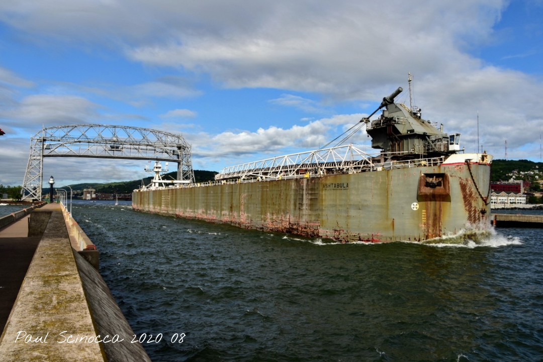 DuluthShips's tweet photo. Tug Defiance/Barge Ashtabula departing Duluth this Sunday morning with a cargo of petroleum coke.
#Duluth
#ship
#AerialBridge https://t.co/9ilDygBEay