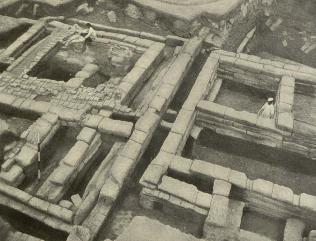 Pic1: One of the smaller openings in western defences with the Lingraja Temple in the background.Pic2: Habitation area, showing the blocks of two houses with a well in between them.Pic3: Entrance door in the habitation area.Pic4: Close view of the holes in the clay rampart