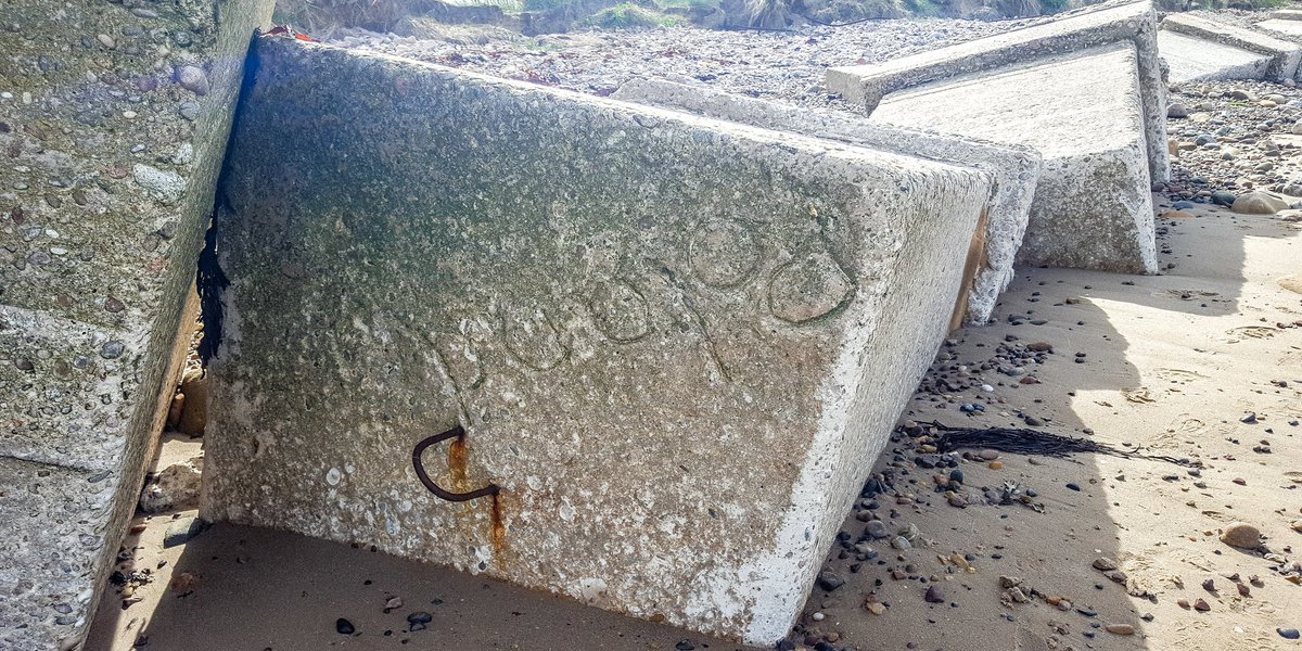 "Poland" was likely written in to the top of this block by one of the young engineers as the concrete was setting 80 years ago.