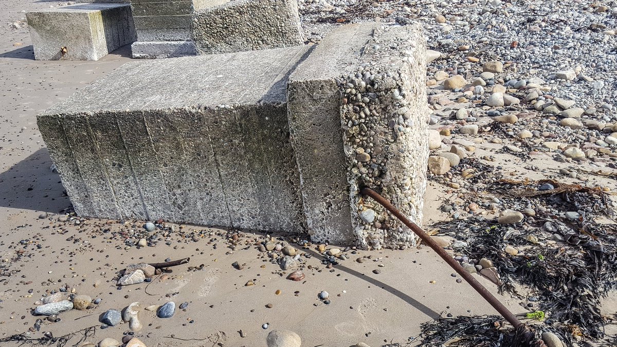 Not sure what the hollow pipe running through the base of the blocks is for. This would've been beneath the sand. Perhaps a cable run?