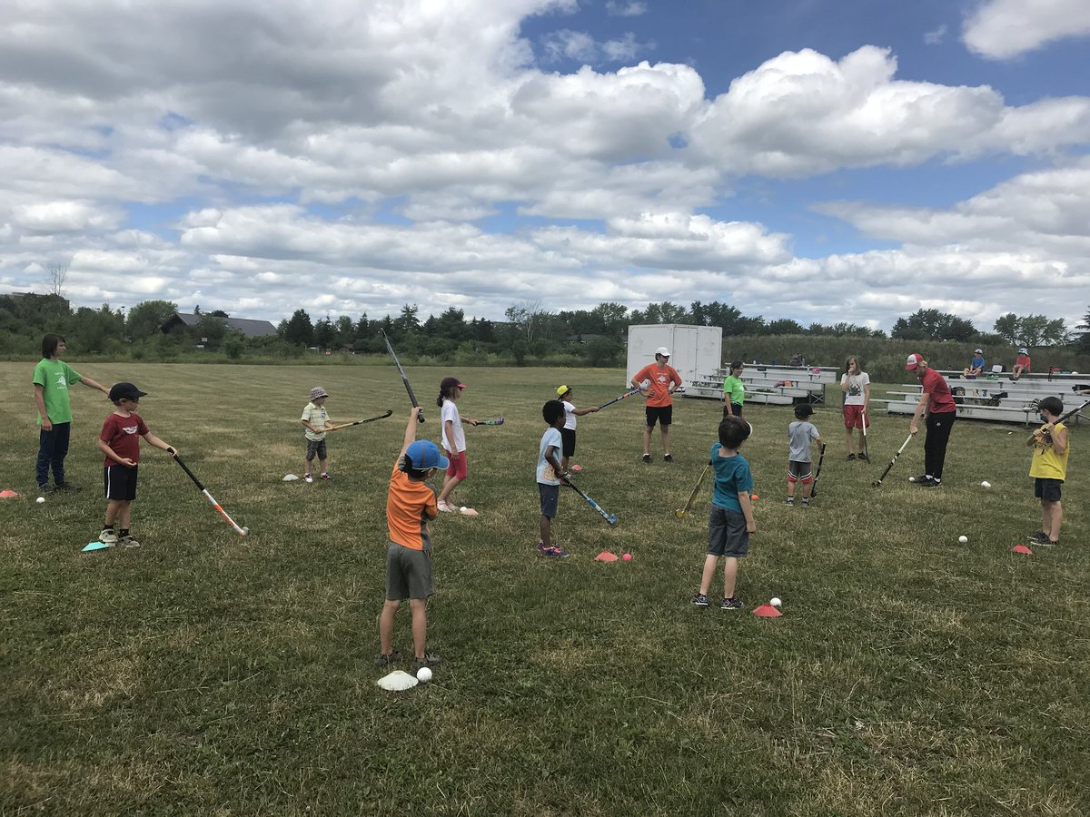 ChelseaFHC's tweet photo. Coach Flynn and Coach Quentin  from Chelsea FHC giving fieldhockey lessons at the local @kineactif kids day camp in Gatineau. Introducing the sport to a younger generation! #fieldhockeycanada https://t.co/V0wPNEF6cz