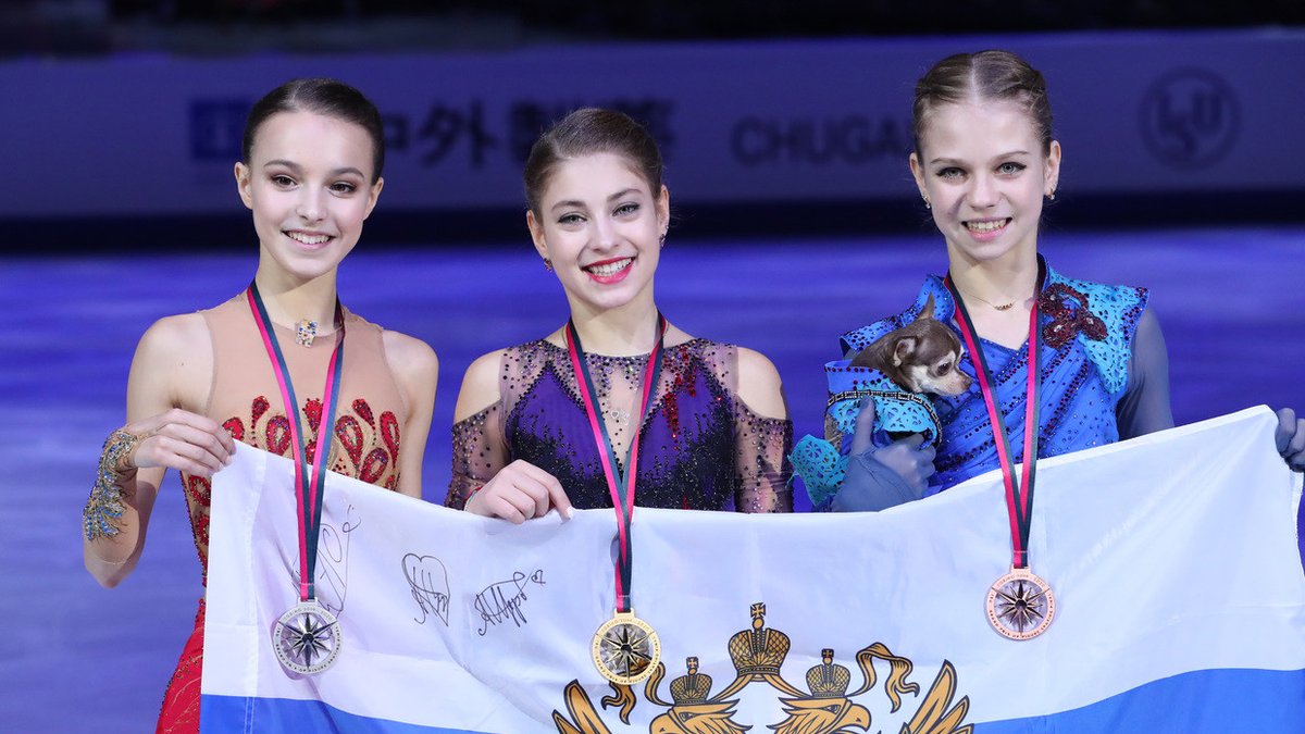 She gets incredible results. At the last Olympics, only one woman had ever landed a quad in competition. Eteri has had *four* girls land quads, some of them very difficult ones that few men do. Here are her girls sweeping the podium at the Grand Prix Final last season.