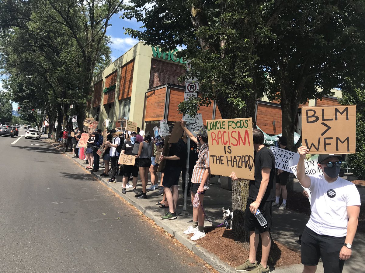 JwJpdx's tweet photo. ✊🏿Defend Black Lives!
✊🏿Now’s the time to unionize!

Whole Foods workers picket after the firing of a worker wearing the company’s own slogan, “Racism Has No Place Here” https://t.co/TGOhg8KkZN