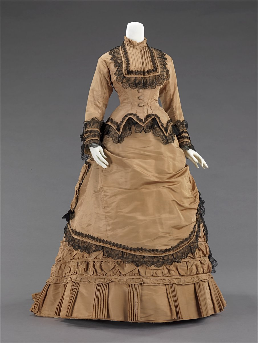 WALKING DRESS: This gown should be hemmed several inches shorter for ease of walking outdoors. It may be simply or elaborately decorated. Such a dress should “. . . be of quiet colors, and never conspicuous.