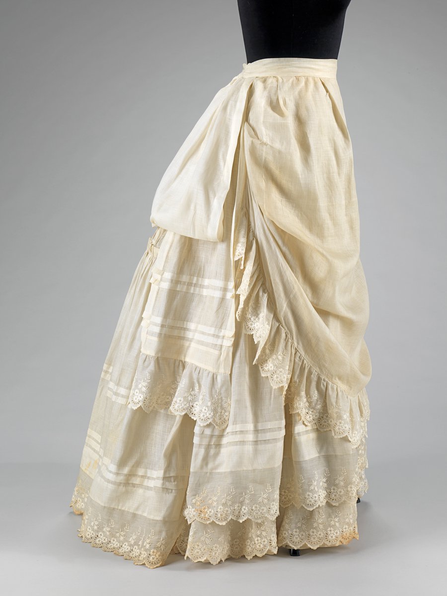 Depending on the era, the lady must have worn petticoats (1830-40s), a crinoline (1850s), an elyptical crinoline (1860s), or a bustle (1870-80s)