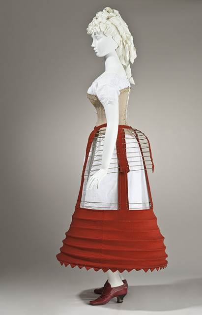 Depending on the era, the lady must have worn petticoats (1830-40s), a crinoline (1850s), an elyptical crinoline (1860s), or a bustle (1870-80s)