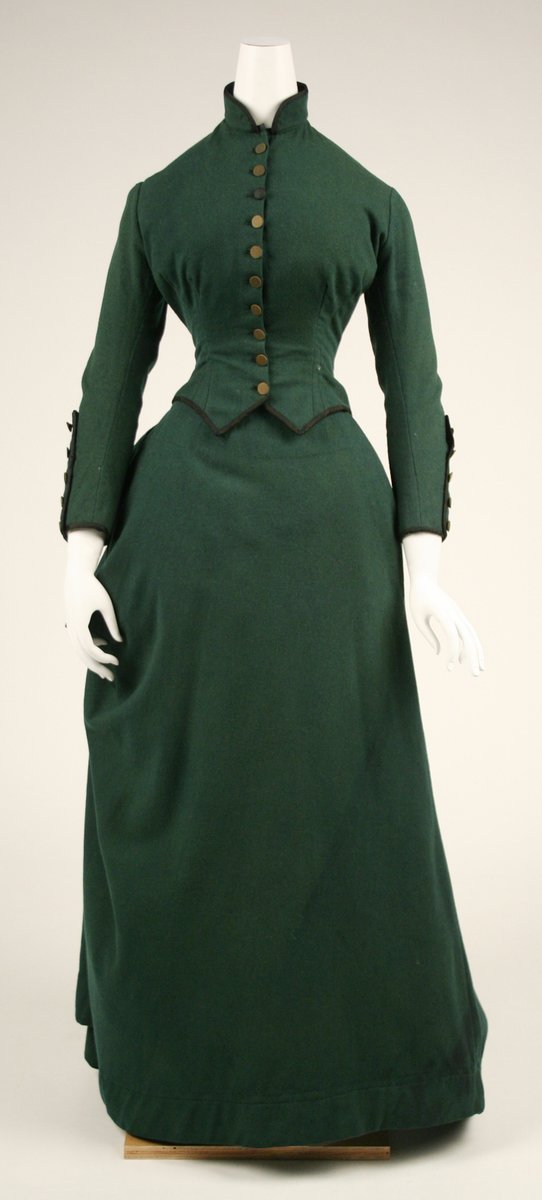 “The most becoming and appropriate riding dress is made to fit the waist closely, and button to the throat, with sleeves (coat pattern) coming to the wrist.”—The Art of Dressing Well, pg 53 (1870)