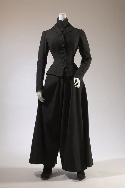 CYCLING ENSEMBLE: A variation on the Bloomer costume is called for while cycling in the later decades. It consists of a split skirt, or else long, full trousers that tuck into a pair of tall boots, and a short, tightly-fitted bodice.