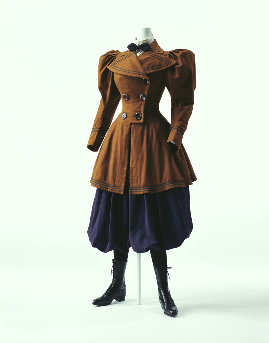 CYCLING ENSEMBLE: A variation on the Bloomer costume is called for while cycling in the later decades. It consists of a split skirt, or else long, full trousers that tuck into a pair of tall boots, and a short, tightly-fitted bodice.