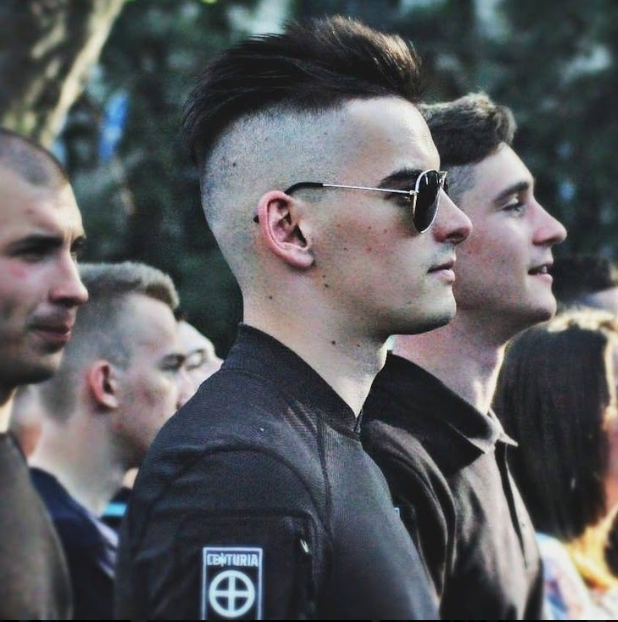 Online the military-oriented "Centuria" has identified an individual with military call sign "Milan" (Milano) as one of its leaders. "Milan" is likely 20-something Yurii Gavrylyshyn, a veteran of the Azov Regiment. Gavrylyshyn also popped up in photos with a "Centuria" patch.