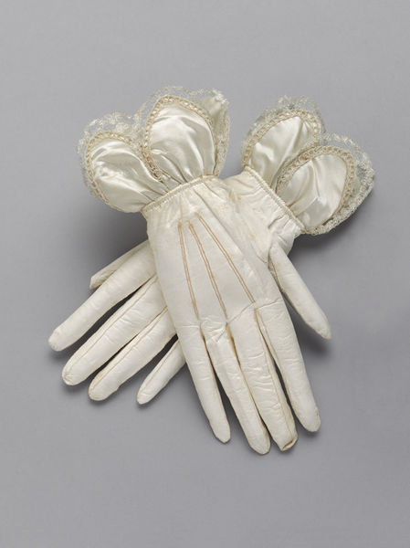 White kid gloves must be worn, or else very pale tints. Rich jewelry is expected. Hair may be dressed with artificial flowers, ribbons, lace, jewels, feathers, or other ornaments. Accessories should include a fan, a small bouquet of flowers, a handkerchief, and a lorgnette.