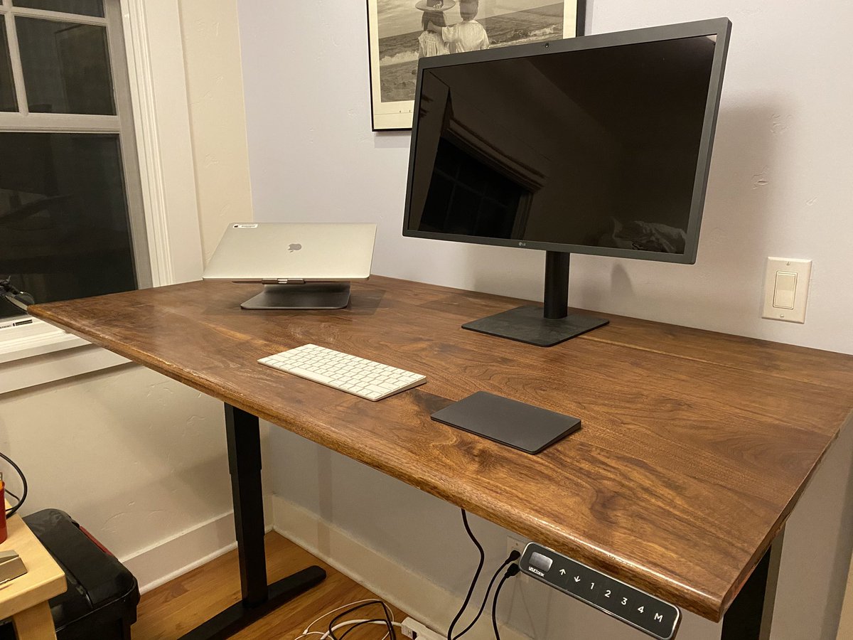 Finally bit the bullet and bought a standing desk. Decided to turn it into a mini-project and made the tabletop myself from some walnut. 10/10 would recommend