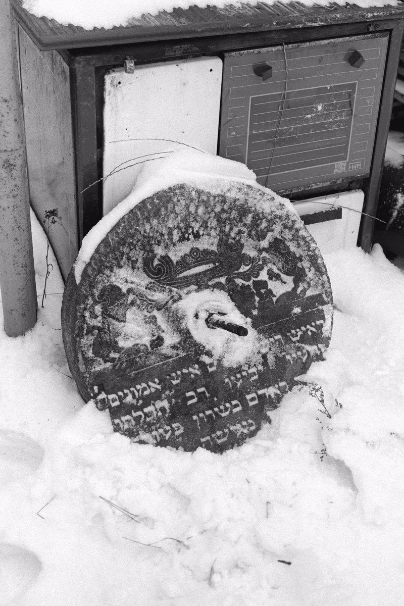 9/ A Jewish tombstone "repurposed" as a grindstone or a wheel, and then abandoned on a Polish farm somewhere. Look at the lions of Judah on this one, and imagine the time it took to carve them.