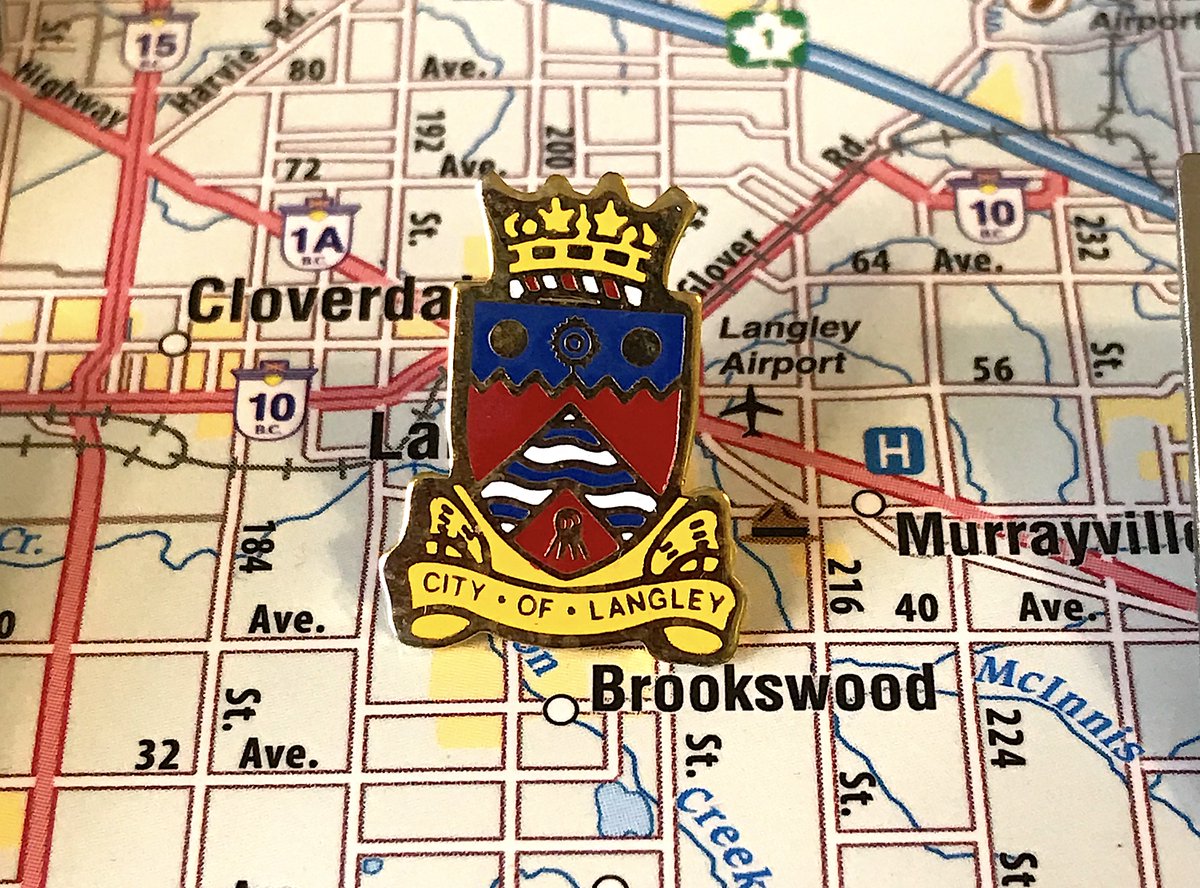 123. LANGLEY CITY - Crest, but in the actual shape, and pretty clean! - Still doesn't tell me much about Langley, other than its royalty, you'll have to fight new west on that- The other pin is very corporate and annoys me