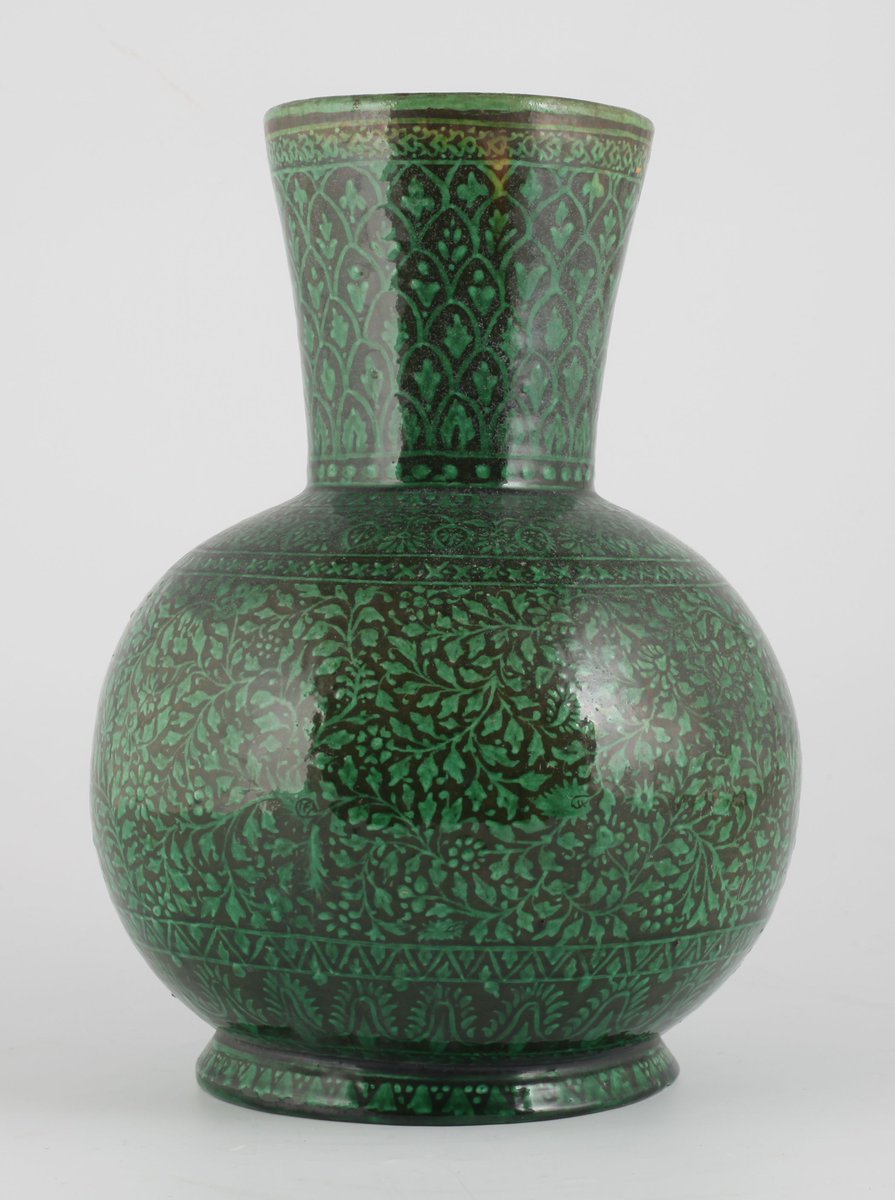 Object number 4 is an earthenware bottle with rich green floral designs was produced c. 1800–79 at the Bombay [Mumbai] School of Art in India.  #SouthAsianHeritageMonth
