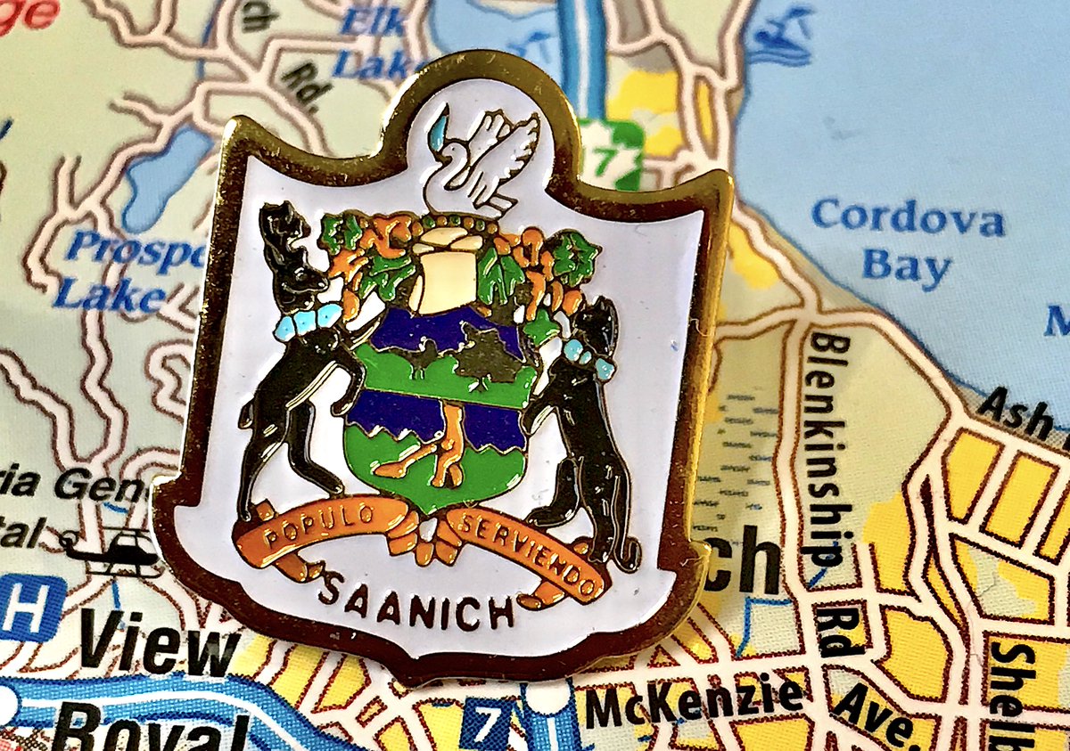 153. SAANICH- Another crest pin!- This time with a better colour scheme- Is that bear...vacuuming? - Latin saying means "serving the people," that's literally your job, BORING