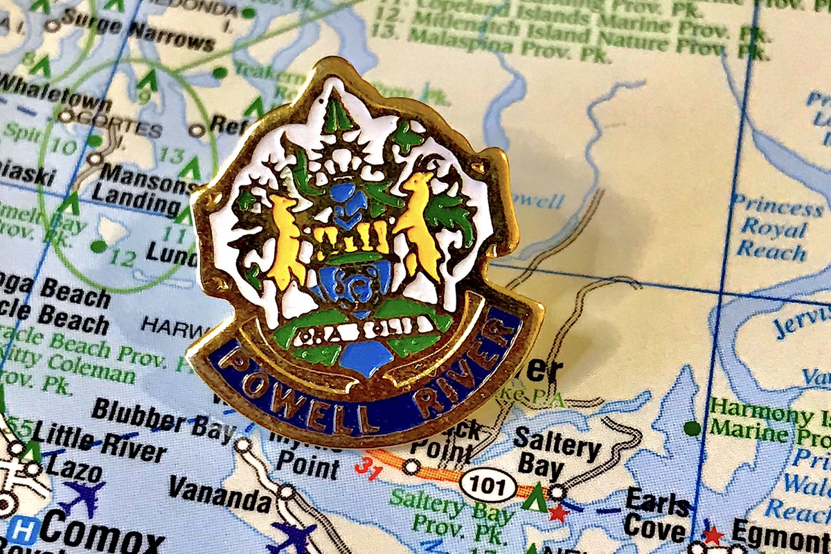 80. POWELL RIVER- let our pin praise the paper mill, sweet titan of industry that sustains us - having literally all the buildings be white was a choice, but that's what happens when you use up your colours on generic green/blue stuff- there's a pin for the crest, boo