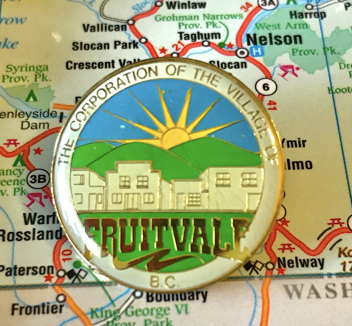 73. FRUITVALE - The Corporation of the Village of WHO CARES- Bold to show specific buildings on your pin that may not exist in future decades- Good colours, fun font for Fruitvale, fully acceptable pin