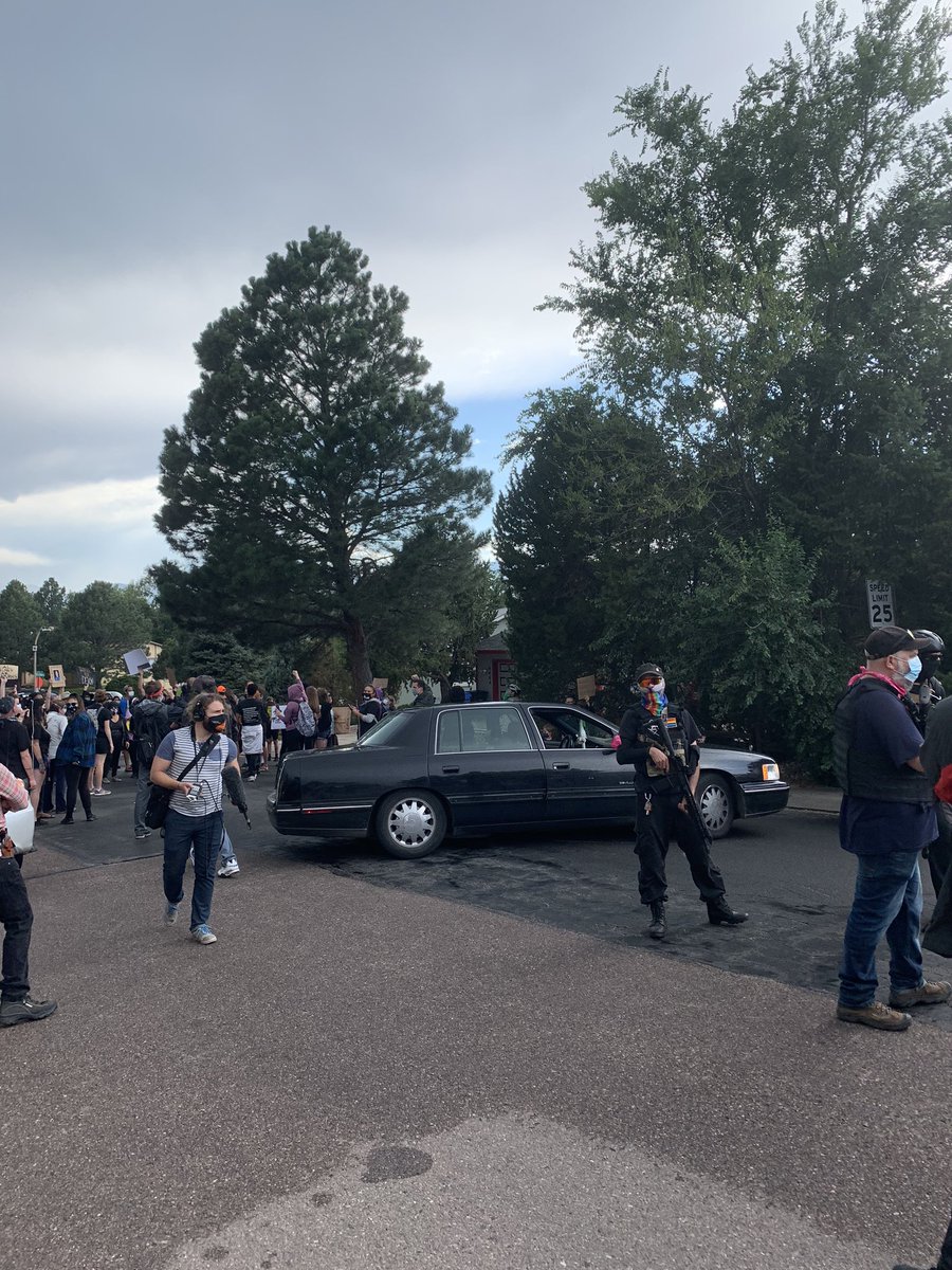 Confrontation with truck guy continues, even though a car was pulled in front of protesters.