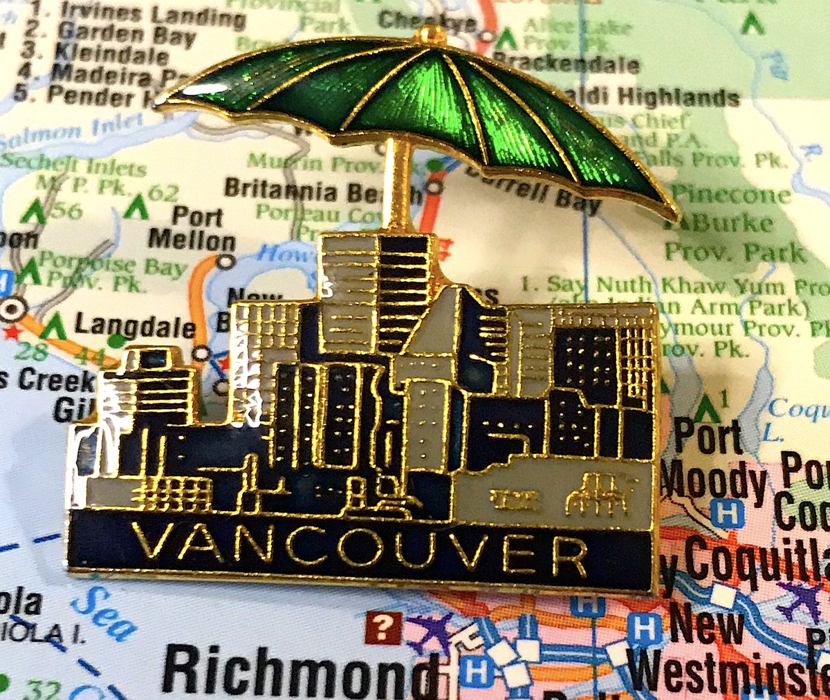 17. VANCOUVER - There are many Vancouver pins; most are quite good - None 100% excite me but maybe that's because I live here- Love how cool and 80s the first one is, delighted by the umbrella in the second- We need more pins with Science World instead of Harbour Centre