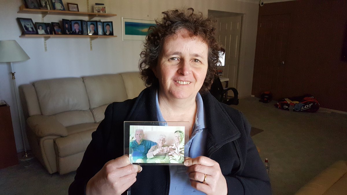 “[I’m] just saying to other families, make sure your elderly mother, or mother-in-law, father, or whatever, is more cautious ... when they go out in the heat” – Evelyn McLeod, in her western Sydney home, holds a photo of her father Chuck, who died in a heatwave in 2018.