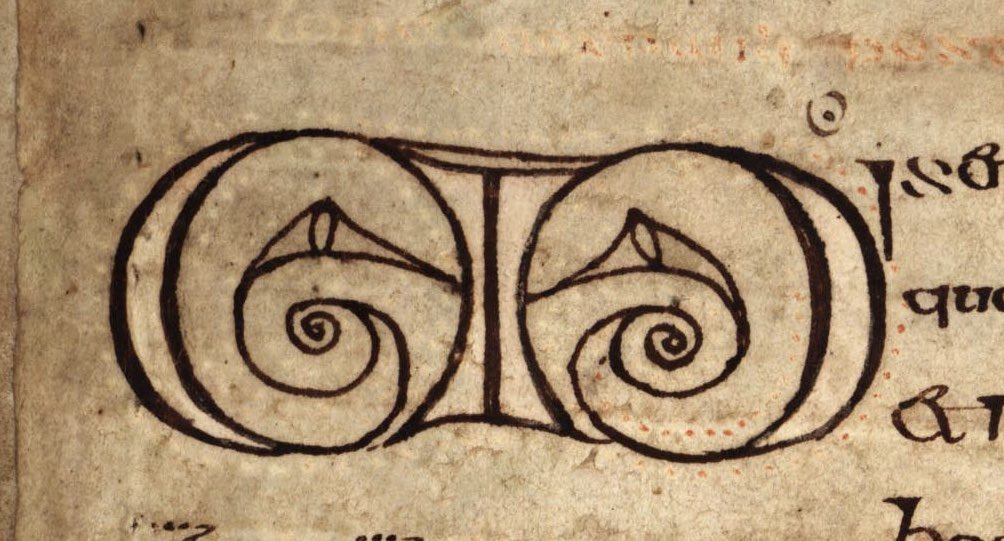 The beautifully neat spiral initial Ms were made using a compass. Take a close look you will see two little dots above the middle spiral, pricked into the vellum. See here also the verso of the folio where the ink is showing through.