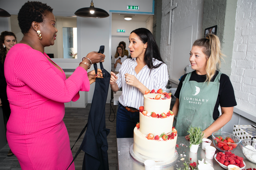 LuminaryBakery's tweet image. Today we're partnering with @camfed to celebrate #empoweringwomen &amp;amp; say a very #HappyBirthdayMeghan who has championed both our work! This pic is of Megan meeting Monica last year, who enthusiastically lent her the apron she was wearing- true to Monica's generous spirit!